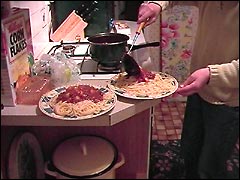 Serving Spag Bol in the holiday cottage