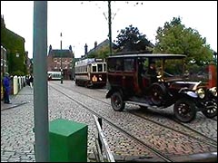 Vintage car crossing the tram tracks Beamish Open Air Museum