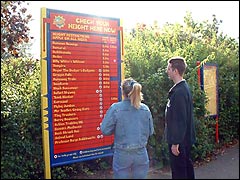 Checking the rides situation board at Chessington