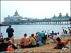 People on Eastbourne beach waiting for the Birdman