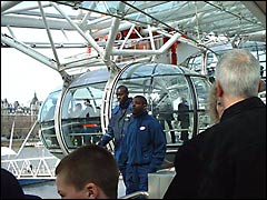 The London Eye operatives guiding people into the capsules