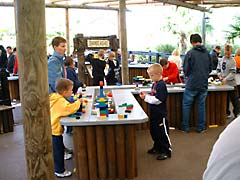 Kids playing with Lego bricks while waiting for the Pirate Falls ride at Legoland