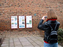 Taking a picture of Canterbury Castle info point