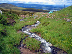 Cairngorm Mountains picturesque scene with stream