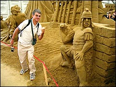 Posing beside a scary Roman sand sculpture