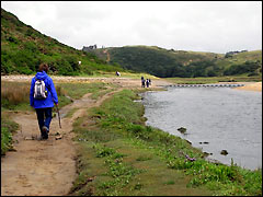 Walking along Pennard Pill at Three Cliffs Bay in Gower
