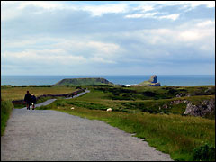Walking towards Worm's Head at Rhossili in Gower