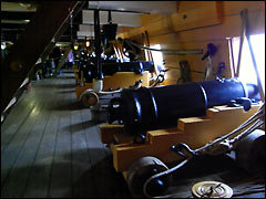 Some of HMS Victory's big guns on the middle gun deck