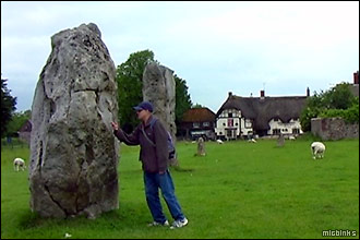 Is it real? Prodding a stone at Avebury in Wiltshire