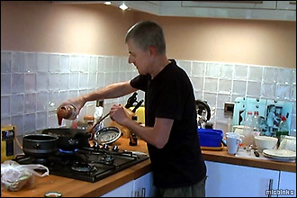 Mike busy cooking in the self-catering holiday cottage