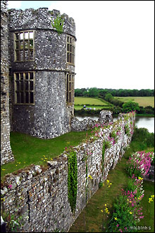 Large windows at Carew Castle overlooking the millpond