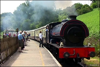 Steam train arriving at Norchard Station on the Dean Forest Railway