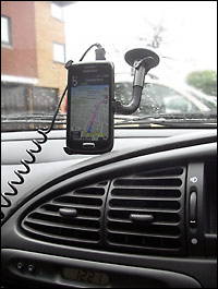 Our smartphone attached to the windscreen suction mount in the car ready to navigate