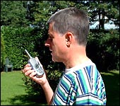 Mike holding the talkie walkie and chatting