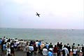 The Nimrod flies past the crowd along the seafront